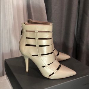 Vince Camuto high heel booties leather color is like cream beige